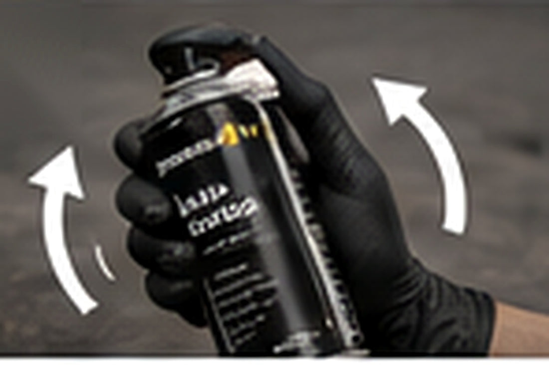 Shaking an aerosol spray paint can thoroughly before use