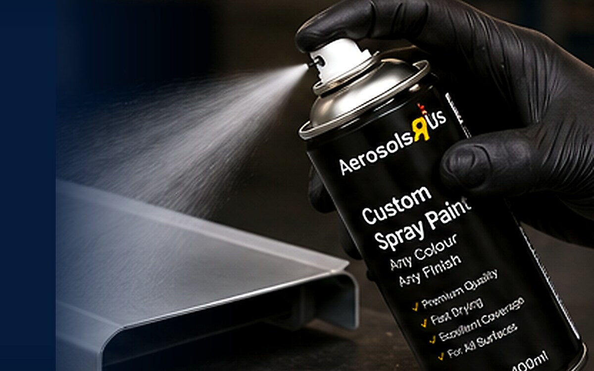 A person applying aerosol spray paint using controlled overlapping passes