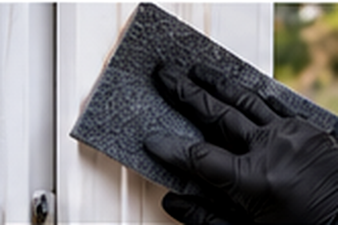 Lightly abrading stable uPVC profile with a fine scuff pad before painting